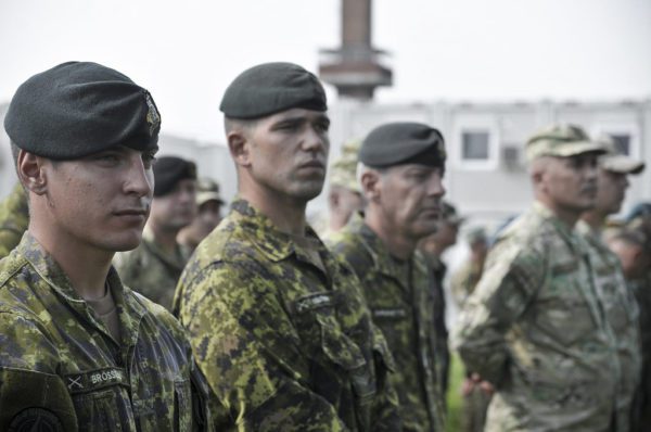 Canadian Air Force personnel standing at attention